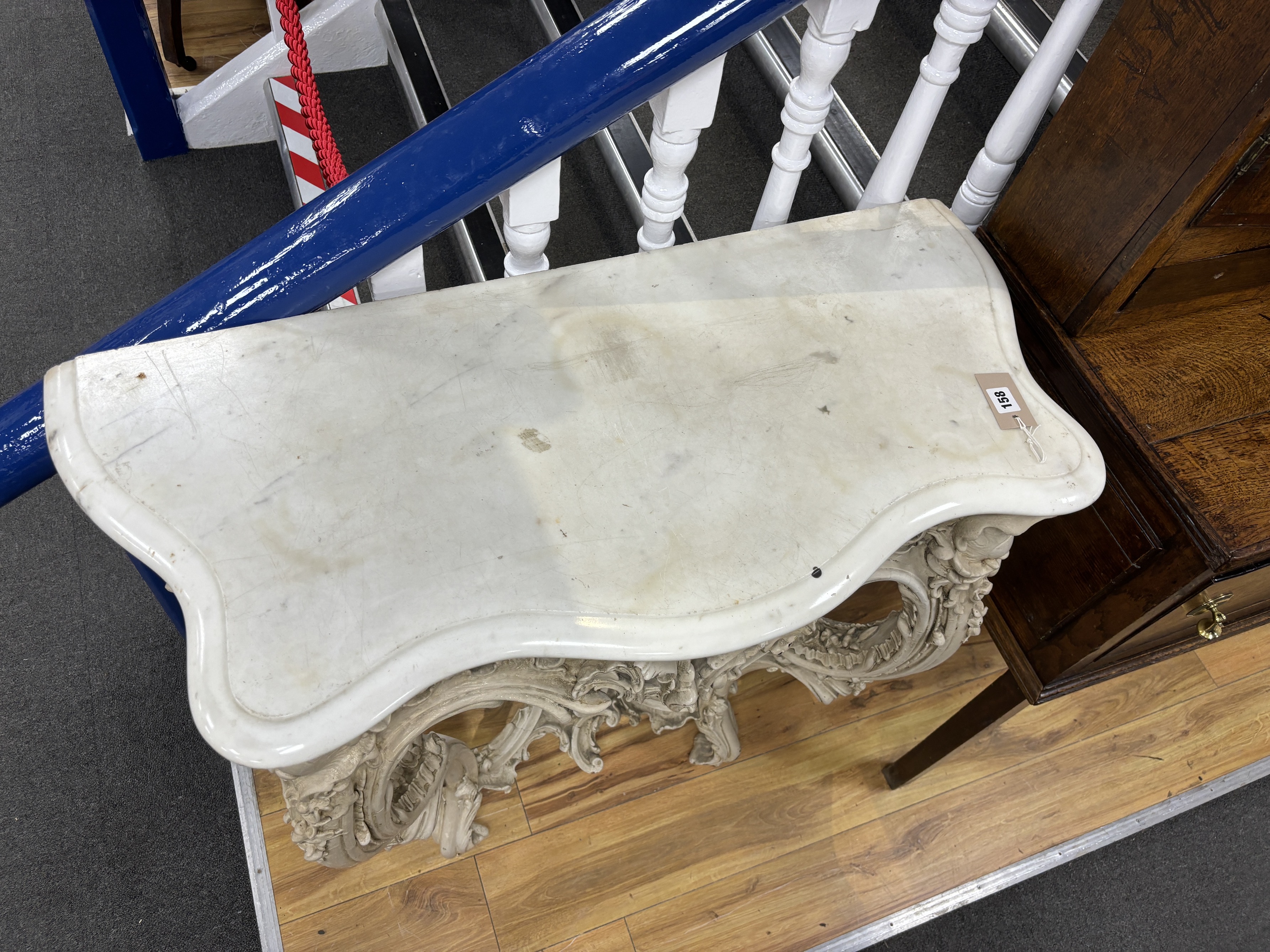 A Victorian carved wood and composition marble top serpentine console table, width 88cm, depth 45cm, height 90cm